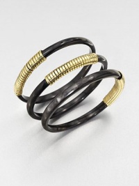 A set of three horn bangles wrapped in shiny brass wire. Recycled ankole cow hornRecycled brassDiameter, about 2.5Slip-on styleImported A set of three horn bangles wrapped in shiny brass wire. Recycled ankole cow hornRecycled brassDiameter, about 2.5Slip-on styleImported