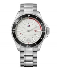 A fantastic find at an everyday value. This classic Tommy Hilfiger watch outlasts trends. Silvertone mixed metal stainless steel bracelet and round case. Rotating bezel with numerals and stick markers. White dial with red accents features silvertone numerals at twelve and six o'clock, luminous stick indices and hands, date window at three o'clock and iconic flag logo. Quartz movement. Water resistant to 30 meters. Ten-year limited warranty. A fantastic find at an everyday value. This classic Tommy Hilfiger watch outlasts trends. Silvertone mixed metal stainless steel bracelet and round case. Rotating bezel with numerals and stick markers. White dial with red accents features silvertone numerals at twelve and six o'clock, luminous stick indices and hands, date window at three o'clock and iconic flag logo. Quartz movement. Water resistant to 30 meters. Ten-year limited warranty.
