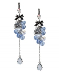 Go ahead, embellish a little. These Betsey Johnson earrings feature clusters of faceted blue and clear glass beads, a silver tone flower charm with crystal accents, a linear chain with blue-colored teardrop crystal, a hematite-plated bow accent and a small crystal accent at post. Crafted in a silver tone mixed metal setting. Approximate drop: 4 inches. Go ahead, embellish a little. These Betsey Johnson earrings feature clusters of faceted blue and clear glass beads, a silver tone flower charm with crystal accents, a linear chain with blue-colored teardrop crystal, a hematite-plated bow accent and a small crystal accent at post. Crafted in a silver tone mixed metal setting. Approximate drop: 4 inches.