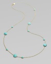 From the Lollipop Collection. Multi-sized, turquoise cabochons, elegantly placed on either side of a radiant, 18k gold chain. Turquoise 18k gold Length around neck, about 37 Diameter, about ¼ - ½ Lobster clasp ImportedPlease note: Due to the characteristics of natural stone, color and pattern may vary slightly. 