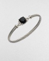From the Petite Wheaton Collection. A beautiful cable design with a center of rich black onyx accented in dazzling diamonds. Sterling silverBlack onyxDiamonds, .08 tcwDiameter, about 2½Hook clasp closureImported 