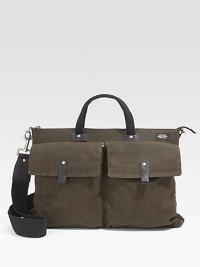 Rugged waxwear is soaked in a centuries-old paraffin formula that combines the durability of nylon and the ease of cotton and accentuates the marks of use. An interior divider adds convenience and organization. Zip closure Leather trim Front and back snap pockets Interior zip, organizing pockets Top handles, 12½ long Adjustable, detachable shoulder strap Fully lined 16½W X 13 X 4D Imported Rugged waxwear is soaked in a centuries-old paraffin formula that combines the durability of nylon and the ease of cotton and accentuates the marks of use. An interior divider adds convenience and organization. Zip closure Leather trim Front and back snap pockets Interior zip, organizing pockets Top handles, 12½ long Adjustable, detachable shoulder strap Fully lined 16½W X 13 X 4D Imported