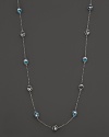 This bold sterling silver lstation necklace gleaming with blue quartz, is a brilliant showcase for Di MODOLO's iconic Triadra design.