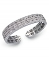 Deck yourself out in diamonds. This exquisite bangle features a cut-out pattern decorated with round-cut diamonds (5/8 ct. t.w.). Set in sterling silver. Approximate diameter 2-1/2 inches.