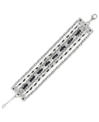 Understated elegance. Subtly adorned with jet blacks beads, 2028's seven-row bracelet is crafted in silver tone mixed metal. Approximate length: 7-1/4 inches + 1/2-inch extender. Understated elegance. Subtly adorned with jet blacks beads, 2028's seven-row bracelet is crafted in silver tone mixed metal. Approximate length: 7-1/4 inches + 1/2-inch extender.