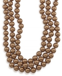 Layer yourself in long and luxurious gold shimmer. Carolee necklace features rich, gold glass pearls (10 mm) set in mixed metal. Approximate length: 72 inches. Layer yourself in long and luxurious gold shimmer. Carolee necklace features rich, gold glass pearls (10 mm) set in mixed metal. Approximate length: 72 inches.