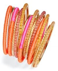 Decorate your wrists with the shimmering colors of summer sunshine. This Bar III bracelet set is a beautiful collection of 15 plastic and mixed metal fabric-wrapped and beaded bracelets in bright orange and pink hues. Approximate diameter: 2-1/2 inches. Decorate your wrists with the shimmering colors of summer sunshine. This Bar III bracelet set is a beautiful collection of 15 plastic and mixed metal fabric-wrapped and beaded bracelets in bright orange and pink hues. Approximate diameter: 2-1/2 inches.