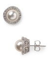 Silver set crystals surround lustrous simulated 8mm pearls to create a simply elegant silhouette. Wear this pair of Nadri stud earrings for have-forever glamour.