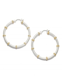 Traditional hoops with a fabulous two tone touch! From the Lauren by Ralph Lauren collection, medium-sized hoop earrings feature a silver tone mixed metal base with gold tone mixed metal accents and click closure. Approximate diameter: 1-1/4 inches. Traditional hoops with a fabulous two tone touch! From the Lauren by Ralph Lauren collection, medium-sized hoop earrings feature a silver tone mixed metal base with gold tone mixed metal accents and click closure. Approximate diameter: 1-1/4 inches.