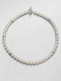 From the Pearl Crossover Collection. A lustrous strand of freshwater pearls accented with sterling silver crossover separators in a long, elegant design. 8mm-8.5mm round white freshwater pearlsSterling silverLength, about 36Toggle closureImported From the Pearl Crossover Collection. A lustrous strand of freshwater pearls accented with sterling silver crossover separators in a long, elegant design. 8mm-8.5mm round white freshwater pearlsSterling silverLength, about 36Toggle closureImported