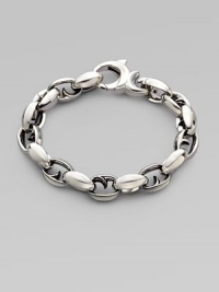Alternating oval and thorn links in polished sterling silver. About 9½ long Lobster clasp Imported Alternating oval and thorn links in polished sterling silver. About 9½ long Lobster clasp Imported