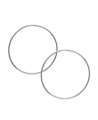 A symbol of endless style -- get a seamless look in traditional hoops. GUESS earrings crafted in a silver tone mixed metal hoop setting. Approximate diameter: 1-1/2 inches. A symbol of endless style -- get a seamless look in traditional hoops. GUESS earrings crafted in a silver tone mixed metal hoop setting. Approximate diameter: 1-1/2 inches.