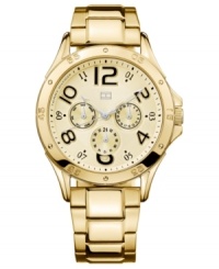 First place style from Tommy Hilfiger. This golden watch boasts an allover shine and multifunctional dial. First place style from Tommy Hilfiger. This golden watch boasts an allover shine and multifunctional dial.