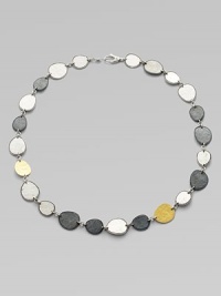 From the Contour Collection. Delicate, free-form discs of hammered sterling silver with light and dark finishes are linked together and accented by discs of 24k gold.Sterling silver and 24k yellow goldLength, about 18Lobster claspImported