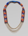 Colorful glass beads in striking geometric shapes cover a leather strap, edged in bold chains with delicate chains draped at the bottom.GlassLeatherGoldtoneCotton backingLength, about 18½Imported