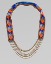 Colorful glass beads in striking geometric shapes cover a leather strap, edged in bold chains with delicate chains draped at the bottom.GlassLeatherGoldtoneCotton backingLength, about 18½Imported