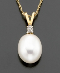 Supreme sophistication. A freshwater pearl (8-10 mm) with diamond accents beams on 14k gold V-shaped bale. Chain measures 16 inches; drop measures 5/8 inch.