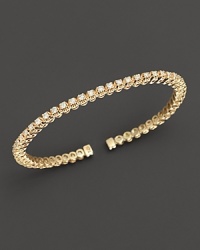 Dazzling diamonds, set in 14K yellow gold, make the perfect bracelet for stacking. Dazzling diamonds, set in 14K yellow gold, make the perfect bracelet for stacking.