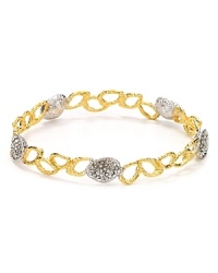 Swarovski crystals rise from two-tone metal plate on this Alexis Bittar bangle, styled as a slim, yet striking statement piece. Swarovski crystals rise from two-tone metal plate on this Alexis Bittar bangle, styled as a slim, yet striking statement piece.