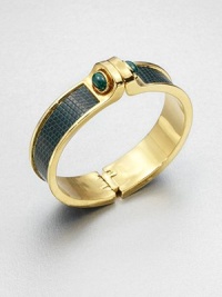 A goldtone cuff accented in luxurious lizard inlay with two malachite cabachons. MalachiteGoldtoneLizardDiameter, about 2.5Hinged closureMade in USA A goldtone cuff accented in luxurious lizard inlay with two malachite cabachons. MalachiteGoldtoneLizardDiameter, about 2.5Hinged closureMade in USA