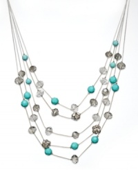 Illusively chic. INC International Concepts' intriguing illusion necklace features five delicate rows of black glass rondelles, plastic turquoise beads, and glass fireballs. Set in 12k gold-plated mixed metal. Approximate length: 18-1/2 inches + 3-inch extender. Approximate drop: 3-1/2 inches. Illusively chic. INC International Concepts' intriguing illusion necklace features five delicate rows of black glass rondelles, plastic turquoise beads, and glass fireballs. Set in 12k gold-plated mixed metal. Approximate length: 18-1/2 inches + 3-inch extender. Approximate drop: 3-1/2 inches.