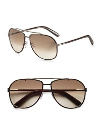 Sporty navigator frames are defined by a metal top bar at the bridge. 100% UV protective Made in Italy Sporty navigator frames are defined by a metal top bar at the bridge. 100% UV protective Made in Italy