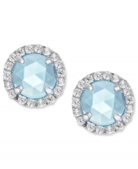 A mesmerizing accent piece, from CRISLU. These stud earrings feature a dome-cut center stone aquamarine (1-1/5 ct. t.w.) surrounded by micro-pave cubic zirconia accents. Earrings set in platinum over sterling silver. Approximate diameter: 1/3 inch. A mesmerizing accent piece, from CRISLU. These stud earrings feature a dome-cut center stone aquamarine (1-1/5 ct. t.w.) surrounded by micro-pave cubic zirconia accents. Earrings set in platinum over sterling silver. Approximate diameter: 1/3 inch.