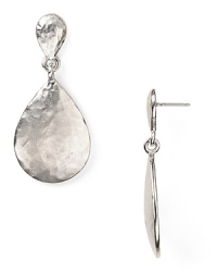 Make easy glamour your statement with Kenneth Jay Lane's hammered silver disc earrings. Boasting a simple shape and subtle sheen, this pair epitomizes effortless accessorizing. Make easy glamour your statement with Kenneth Jay Lane's hammered silver disc earrings. Boasting a simple shape and subtle sheen, this pair epitomizes effortless accessorizing.