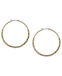 Twice more, with feeling. BCBGeneration's hoop earrings, crafted from gold-tone mixed metal, get stylish geometric accents for a textured feel that's sure to please. Twice more, with feeling. BCBGeneration's hoop earrings, crafted from gold-tone mixed metal, get stylish geometric accents for a textured feel that's sure to please.