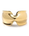 Sculptural elegance defines this gleaming Robert Lee Morris cuff, crafted of gold plated metal.