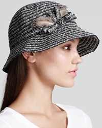 This oh-so-refined cloche from August Accessories plucks its style right from the runways, with natty feathered accents. This oh-so-refined cloche from August Accessories plucks its style right from the runways, with natty feathered accents.