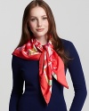 A vibrant silk scarf with large floral Ganini print all over from Salvatore Ferragamo.