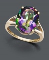 Let a faceted rainbow of color decorate your digits. A large oval-cut mystic topaz gemstone (7-1/6 ct. t.w.) sits in a split band 14k gold setting decorated with two diamond side accents.