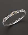Detailed in 18K yellow gold, Judith Ripka's sterling silver and raspberry crystal bangle lends a timelessly luxe look.
