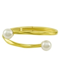 From the island of Mallorca, Spain, this beautiful hinged bangle bracelet features white organic man-made pearls (12 mm) set in 18k gold over sterling silver. Approximate diameter: 2-1/2 inches.