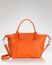 This season, Longchamp gives it's signature Le Pliage bag a luxe update. Now in super-soft leather, it's a rich take on the practical style you need (and love.) This season, Longchamp gives it's signature Le Pliage bag a luxe update. Now in super-soft leather, it's a rich take on the practical style you need (and love.)