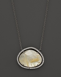Diamonds circle a faceted yellow quartz and mother-of-pearl doublet set in blackened sterling silver. By Di Massima. Diamonds circle a faceted yellow quartz and mother-of-pearl doublet set in blackened sterling silver. By Di Massima.