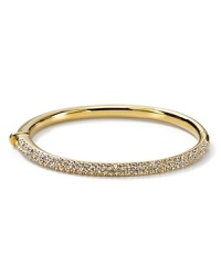 The slender bangle from Nadri is crafted in polished rhodium plate with a triple-row of gleaming crystal pave to a bring a touch of light. The slender bangle from Nadri is crafted in polished rhodium plate with a triple-row of gleaming crystal pave to a bring a touch of light.