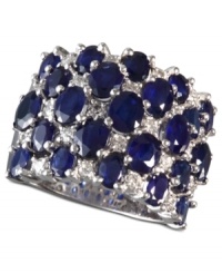 A true blue beauty! EFFY Collection's bold and beautiful cocktail ring highlights dozens of oval-cut sapphires (7-1/6 ct. t.w.) and sparkling round-cut diamonds (5/8 ct. t.w.). Band set in 14k white gold. Approximate width: 7/8 inch. A true blue beauty! EFFY Collection's bold and beautiful cocktail ring highlights dozens of oval-cut sapphires (7-1/6 ct. t.w.) and sparkling round-cut diamonds (5/8 ct. t.w.). Band set in 14k white gold. Approximate width: 7/8 inch.