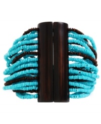 A touch of turquoise on your wrist. This Kenneth Cole New York bracelet features multiple strands of turquoise and brown seed beads joined by a stark brown closure. Stretches for a customized fit. Approximate length: 7-1/2 inches. A touch of turquoise on your wrist. This Kenneth Cole New York bracelet features multiple strands of turquoise and brown seed beads joined by a stark brown closure. Stretches for a customized fit. Approximate length: 7-1/2 inches.