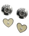 Show your love for GUESS! This cute set-of-2 stud earrings create instant style with ivory epoxy hearts with stud detail and silver tone buttons with glass stone and logo accents. Set in imitation rhodium-plated mixed metal. Approximate diameter (button): 5/8 inch. Approximate diameter (heart): 1/2 inch.