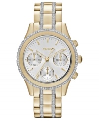Golden shine and swirling rings of crystal accents prettify this timeless steel watch from DKNY. Golden shine and swirling rings of crystal accents prettify this timeless steel watch from DKNY.