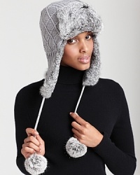 A cute and cozy knit aviator hat that features dyed fur ears, pom-pon ties and a flip-up brim. A cute and cozy knit aviator hat that features dyed fur ears, pom-pon ties and a flip-up brim.