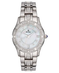 A stunning watch from Bulova with timeless glamor and style. Silvertone stainless steel bracelet with crystal accents and round case. Crystal accents at bezel. Round mother-of-pearl dial with logo and Roman numerals at indices. Quartz movement. Water resistant to 30 meters. Three-year limited warranty.