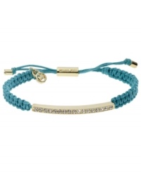 All that sparkles. Michael Kors' pretty macrame bracelet features woven turquoise cotton cord with a gold tone mixed metal bar, accented with glistening pave glass stones. Clasp, setting and logo charms crafted in gold tone mixed metal. Approximate diameter: 2 to 2-3/4 inches. Bracelet adjusts to fit wrist. All that sparkles. Michael Kors' pretty macrame bracelet features woven turquoise cotton cord with a gold tone mixed metal bar, accented with glistening pave glass stones. Clasp, setting and logo charms crafted in gold tone mixed metal. Approximate diameter: 2 to 2-3/4 inches. Bracelet adjusts to fit wrist.