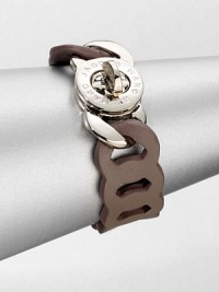 An unique design that features supple leather in a link chain motif with a logo engraved turnlock closure. LeatherRhodium-plated brassLength, about 7.6Turnlock closureImported An unique design that features supple leather in a link chain motif with a logo engraved turnlock closure. LeatherRhodium-plated brassLength, about 7.6Turnlock closureImported