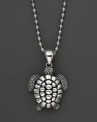 A playful sea turtle dangles from a sterling silver ball chain on this everyday necklace from Lagos. A playful sea turtle dangles from a sterling silver ball chain on this everyday necklace from Lagos.