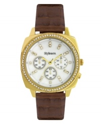 Embrace elegance with this sparkling watch by Style&co. Brown croc-embossed leather strap and round gold tone mixed metal case. Bezel embellished with crystal accents. White mother-of-pearl dial features crystal accent markers, three multifunctional subdials, three gold tone hands and logo. Quartz movement. Splash resistant. Two-year limited warranty. Embrace elegance with this sparkling watch by Style&co. Brown croc-embossed leather strap and round gold tone mixed metal case. Bezel embellished with crystal accents. White mother-of-pearl dial features crystal accent markers, three multifunctional subdials, three gold tone hands and logo. Quartz movement. Splash resistant. Two-year limited warranty.
