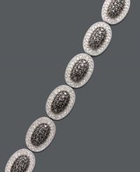 Revel in luxurious links. This oval-shaped bracelet features sparkling black diamonds (1/4 ct. t.w.) and white diamonds (1/4 ct. t.w.) brought together for chic contrast. Set in sterling silver. Approximate length: 7-1/4 inches. Revel in luxurious links. This oval-shaped bracelet features sparkling black diamonds (1/4 ct. t.w.) and white diamonds (1/4 ct. t.w.) brought together for chic contrast. Set in sterling silver. Approximate length: 7-1/4 inches.