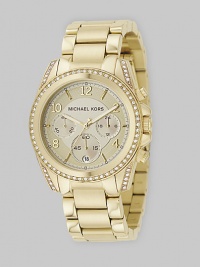 A classic chronograph with designer style, in IP (ionic plating) gold stainless steel with sparkling accents of Swarovski crystal. A classic chronograph with designer style, in IP (ionic plating) gold stainless steel with sparkling accents of Swarovski crystal.